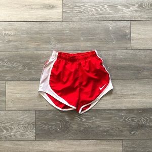 red and white NIKE shorts